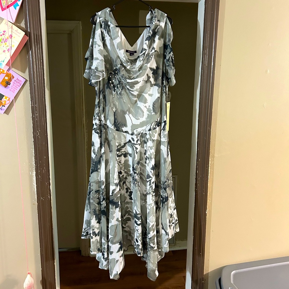 New with tags, Gorgeous black and white gown sequence ruffle sleeves. Size 24
